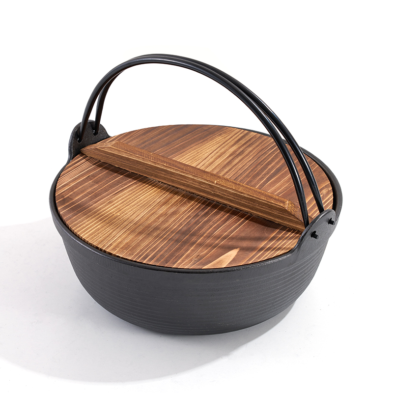 Olla de hierro fundido con tapa de madera